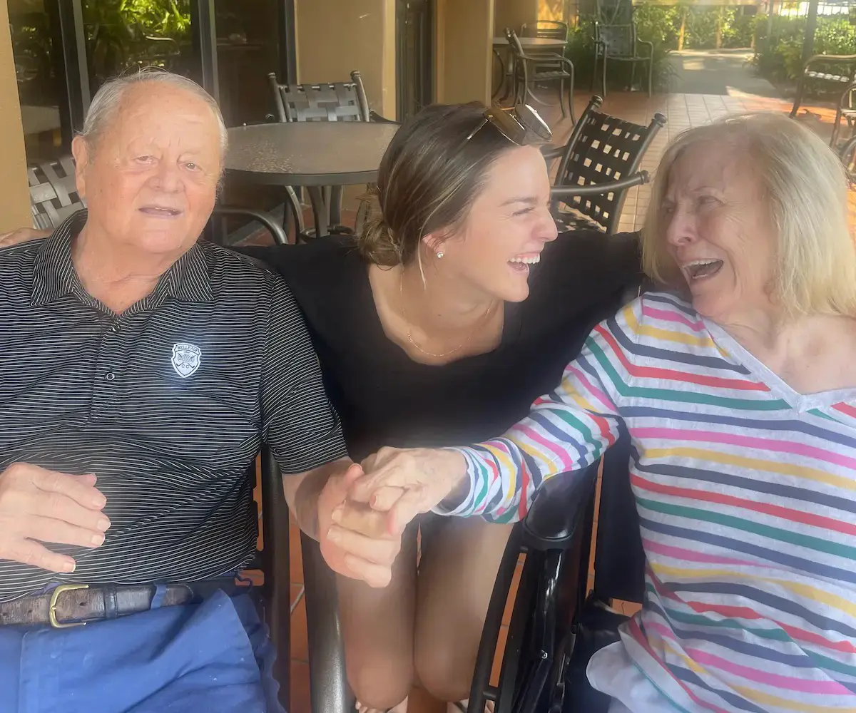 High school student caring for a senior citizen in a care facility